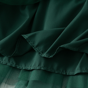 Maxikjol med ett moln av rynkade volanger