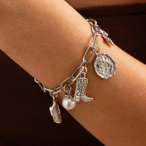 Chunky guldhalsband och armband med western-berlocker