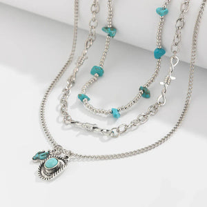 Set med tre silverfärgade westernhalsband med turkos Silver